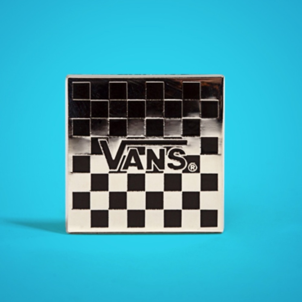 Vans checkerboard collectible pin.
